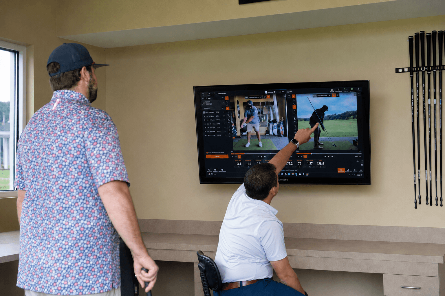 A Profectus Golf coach reviewing swing video with a golfer during an Initial Performance Session