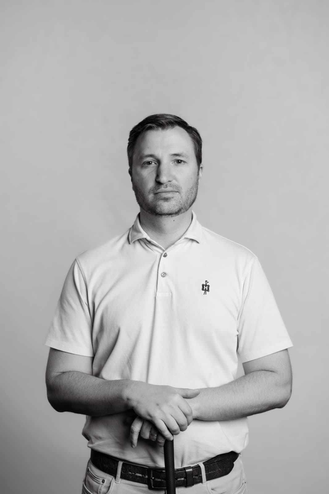 Errol Helling, PGA Professional and founder of Profectus Golf, leaning on a golf club