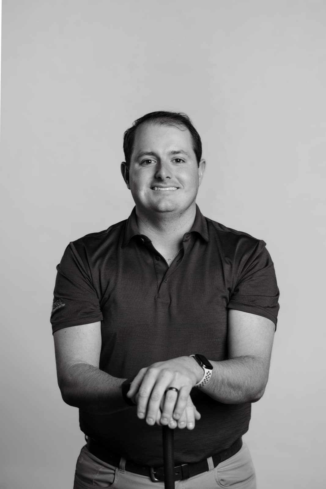Matt Salva, PGA Professional at Profectus Golf, leaning on a golf club